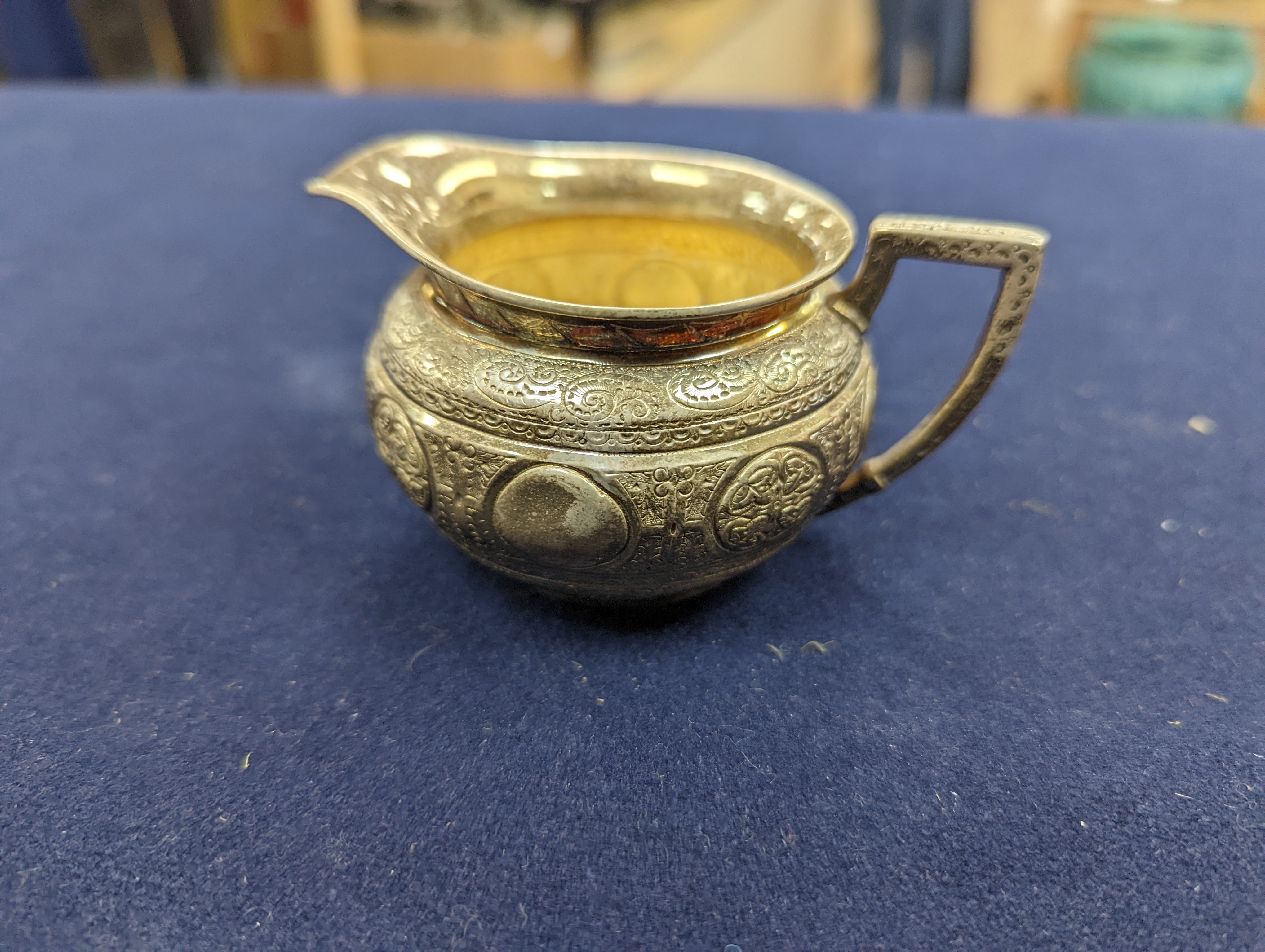 A WMF dish, Islamic white metal mounted photo album and a plated teapot and jug